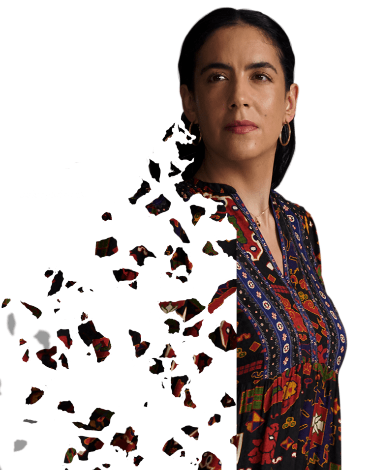 A woman standing and staring straight into the distance. Actor portrayal.